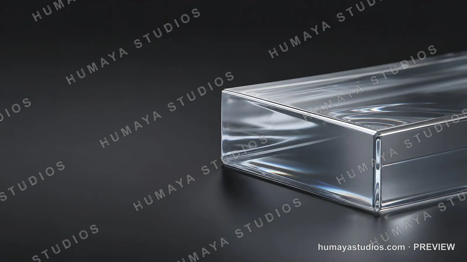 Transparent glass block on dark surface