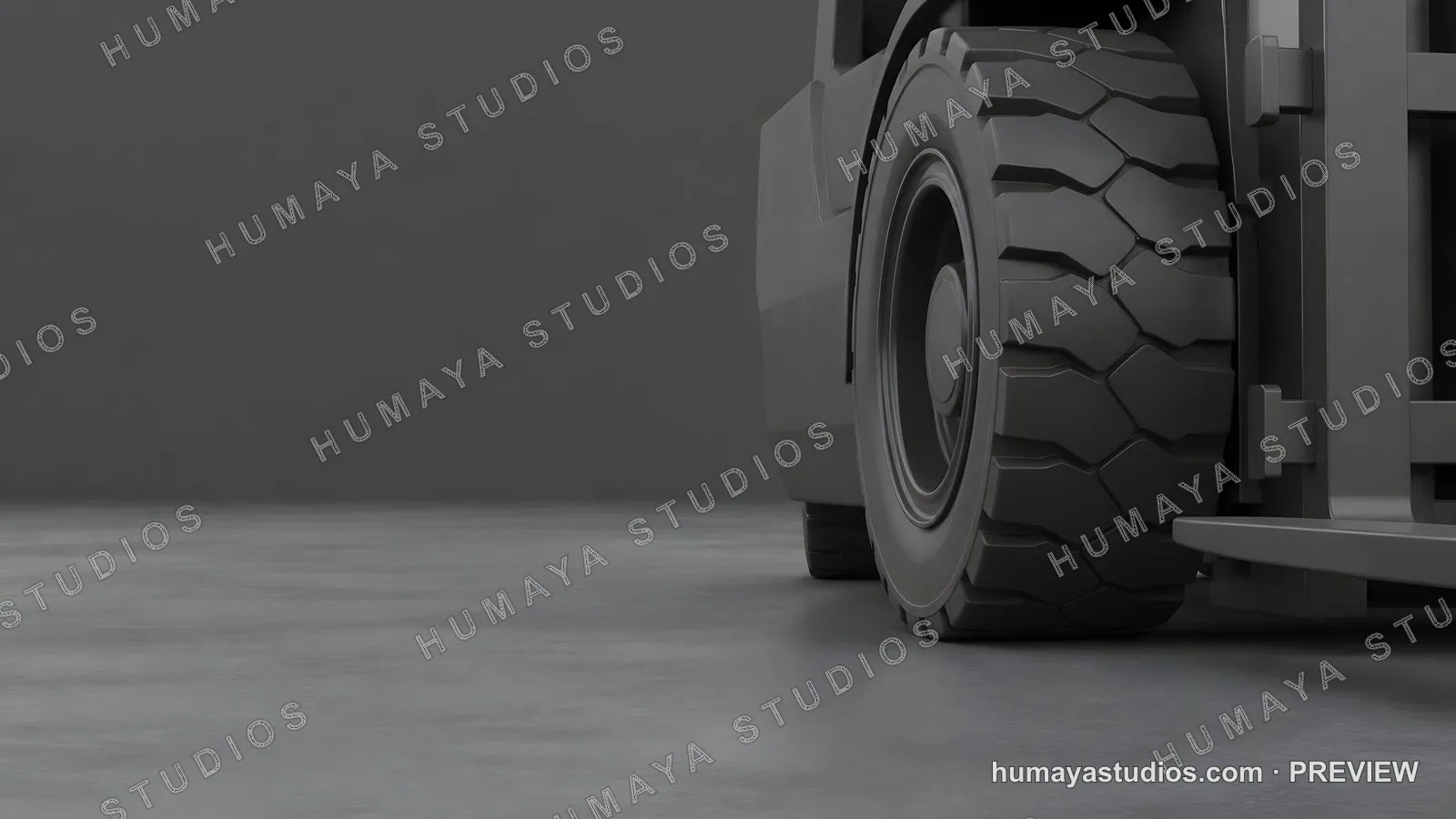 Close up of forklift wheel on concrete floor in warehouse