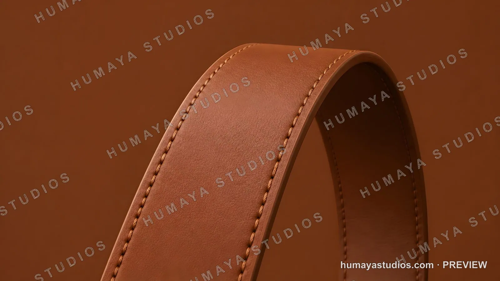 Brown leather strap with stitching on solid background