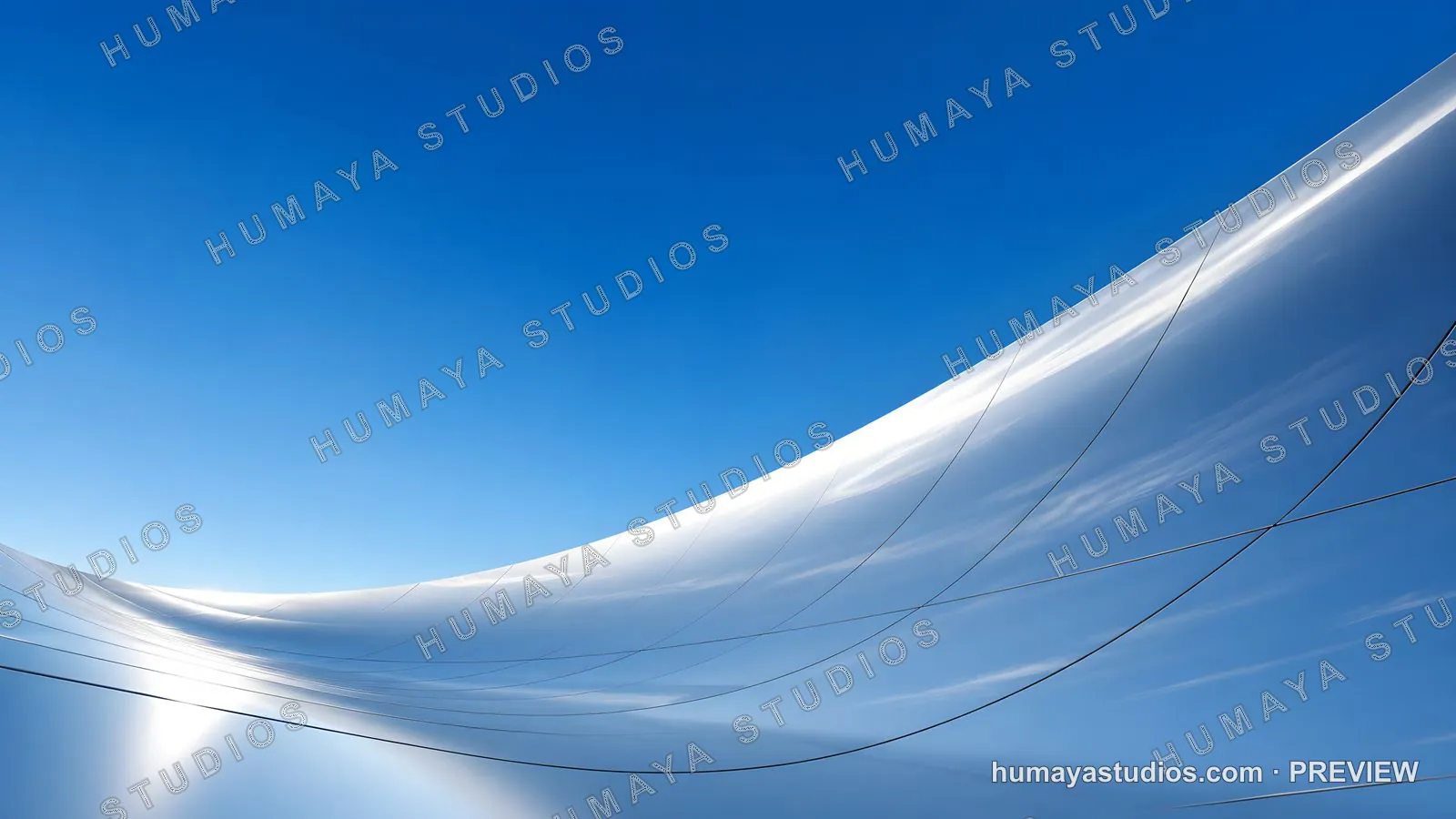 Futuristic Metallic Curved Architecture Under Clear Blue Sky