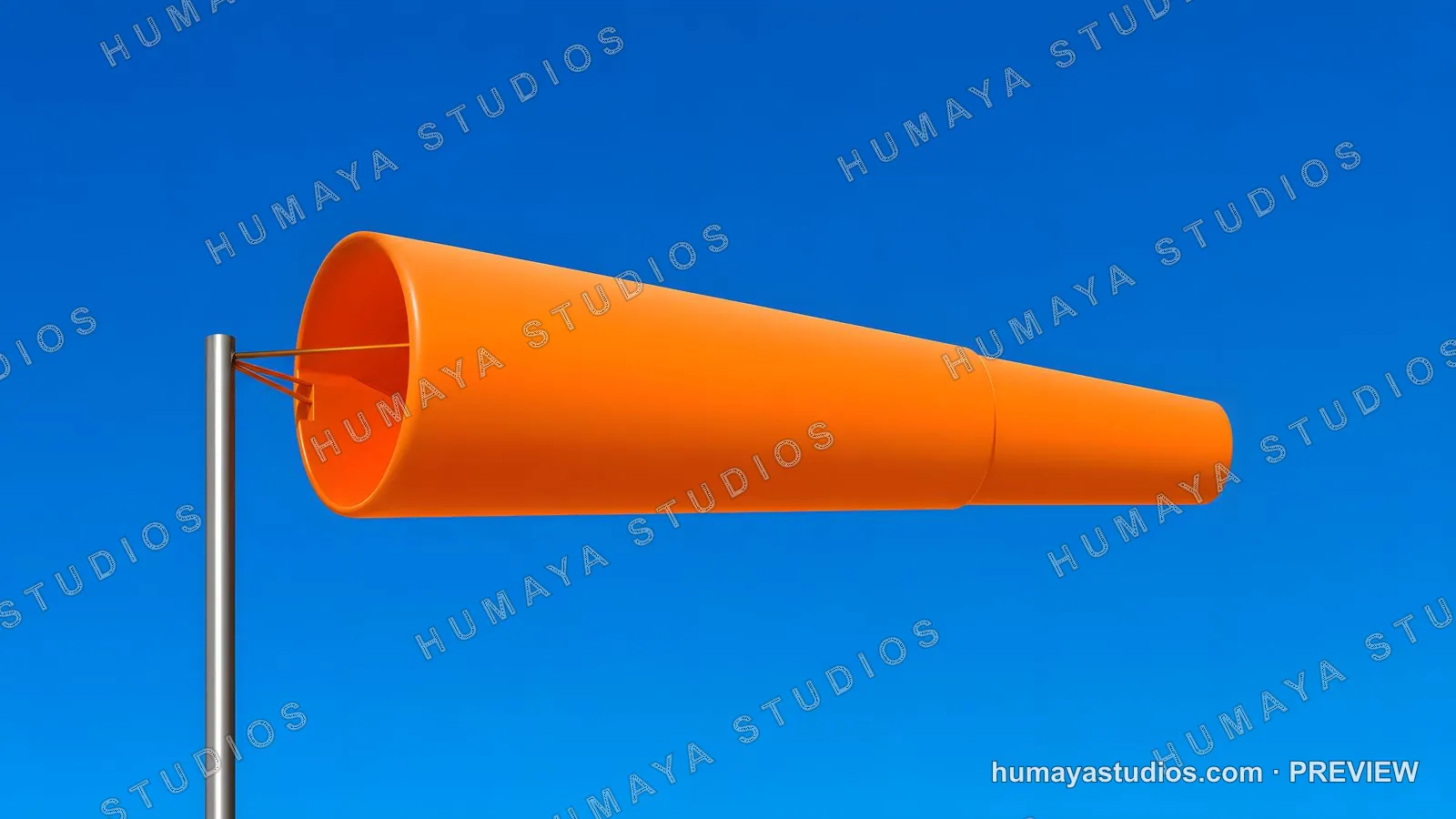 Orange windsaint on metal pole against clear blue sky