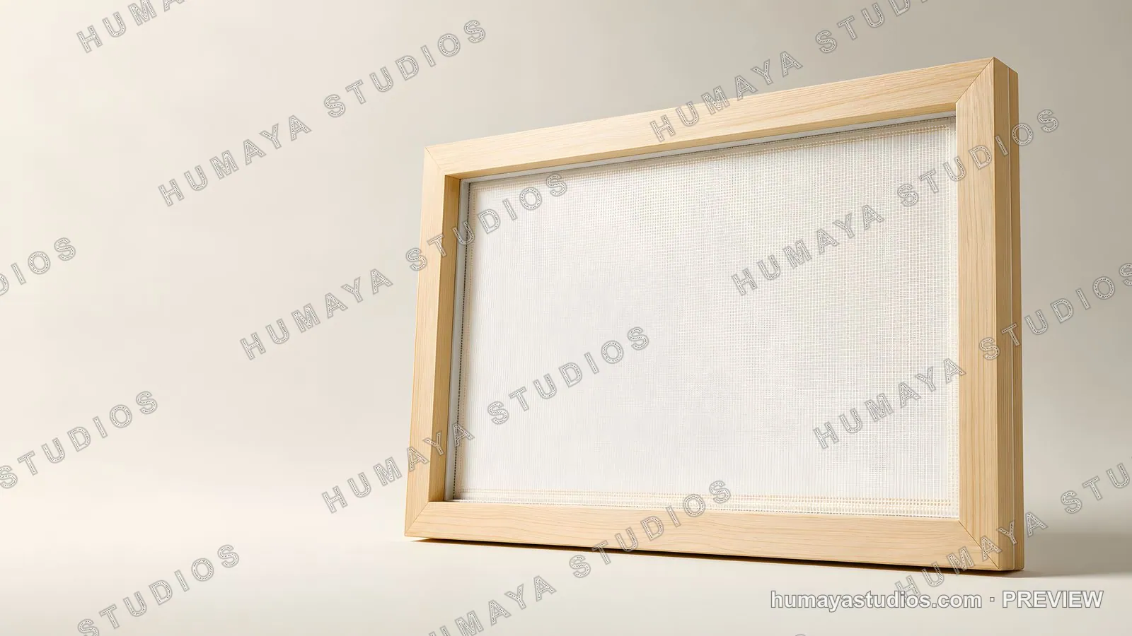 Wooden picture frame with empty white canvas on beige background