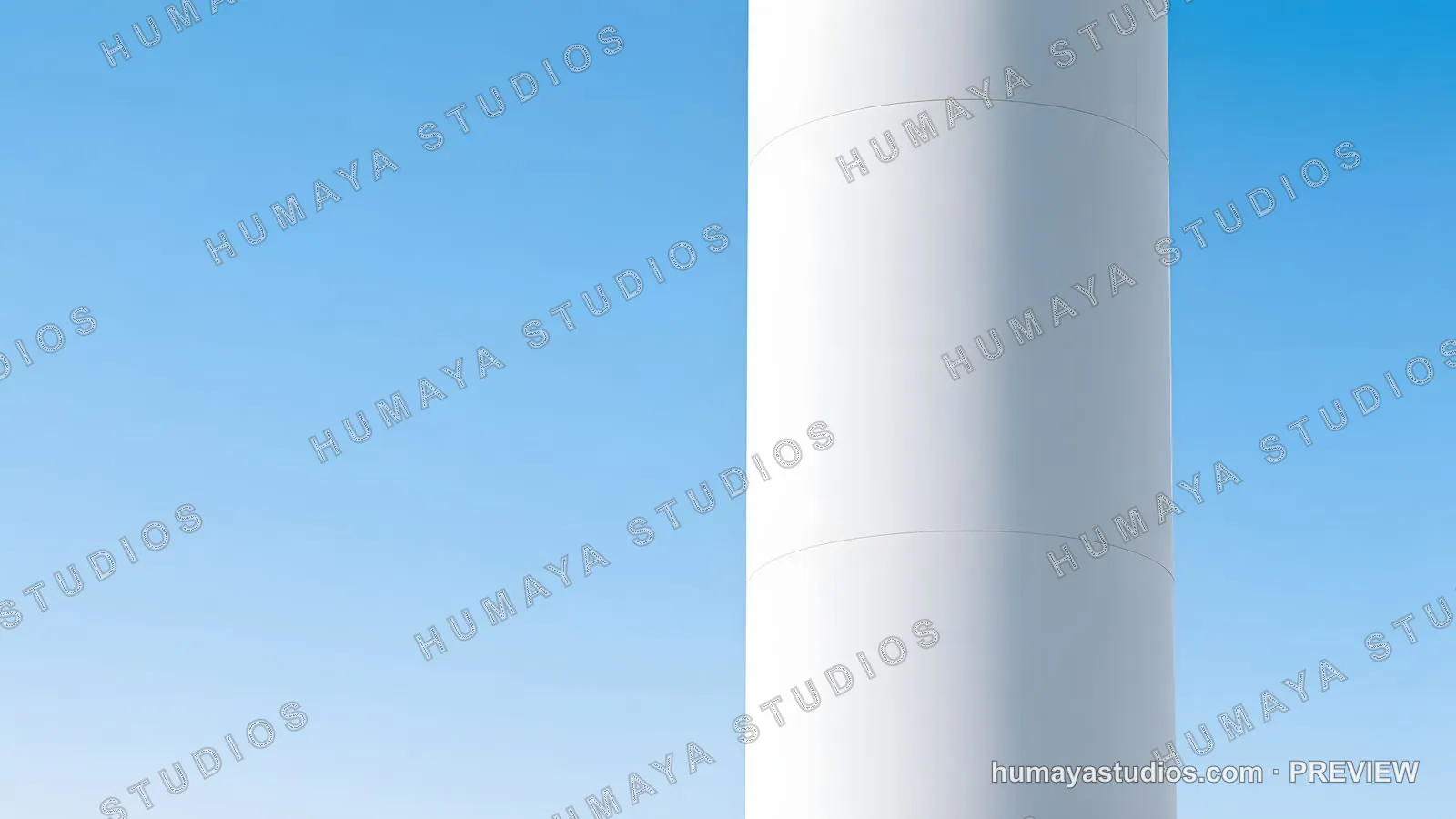 Wind turbine tower section against clear blue sky, minimal architecture