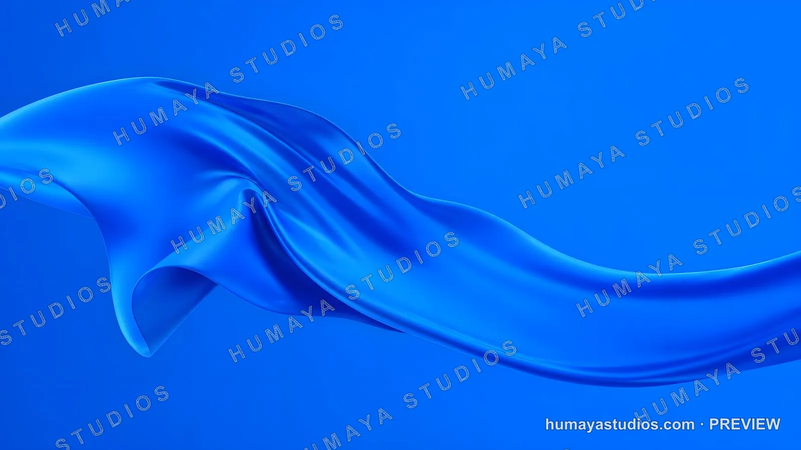 Blue silk fabric wave flowing in the wind against solid background
