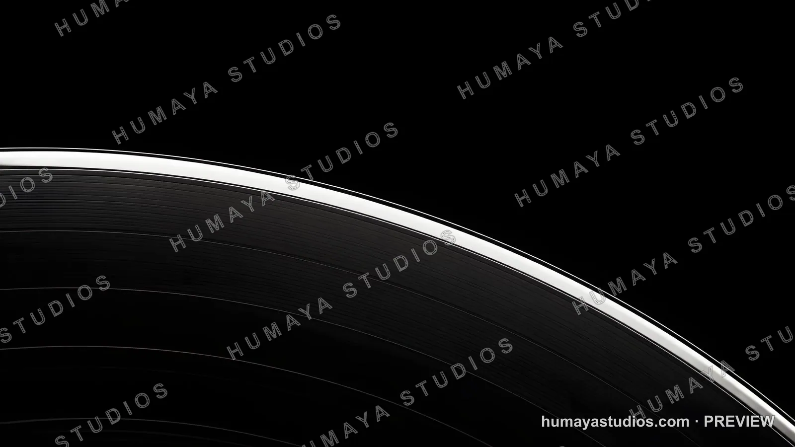 Close-up of a vinyl record groove against a black background