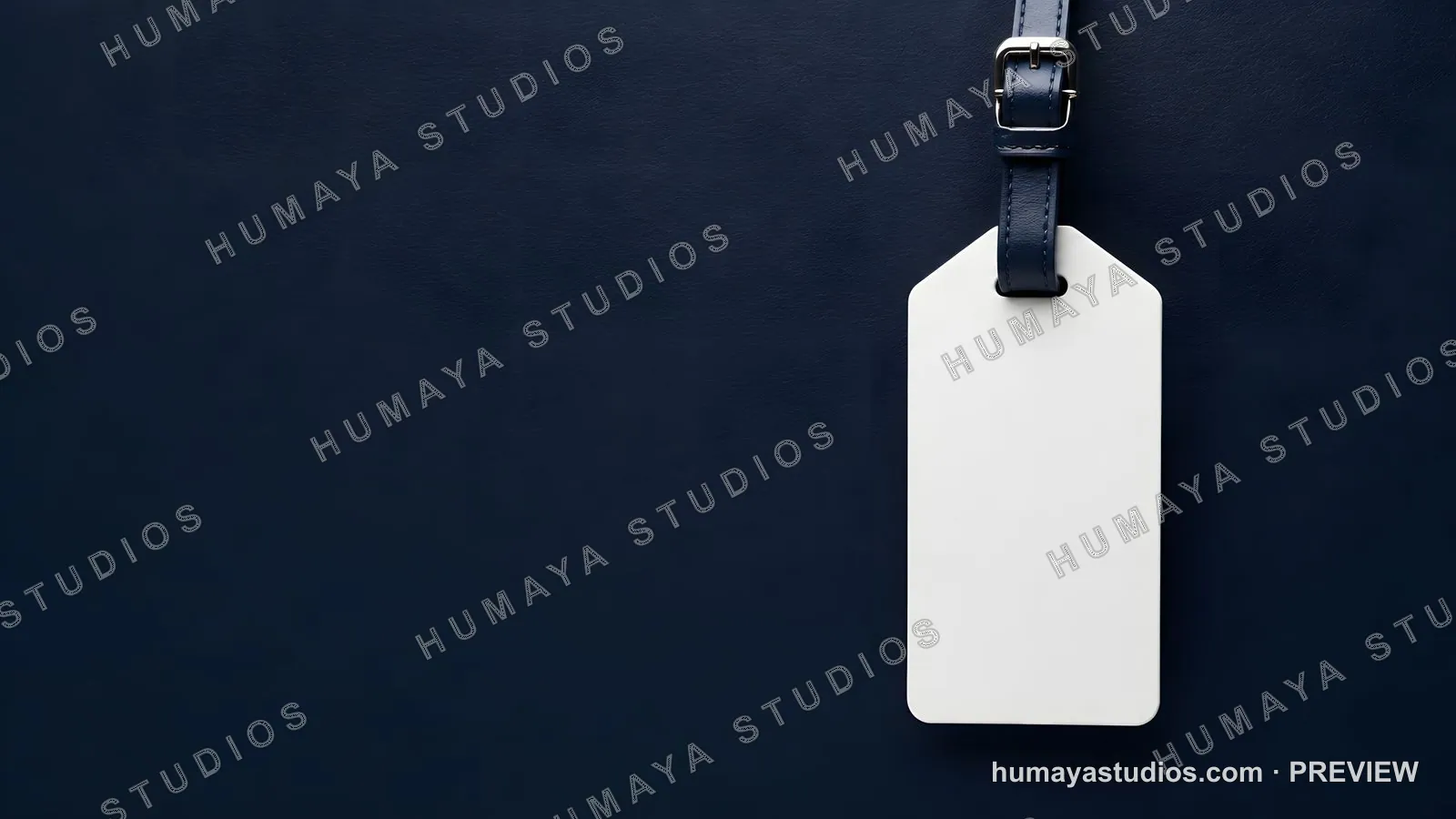 Blank white luggage tag mockup on dark blue leather background
