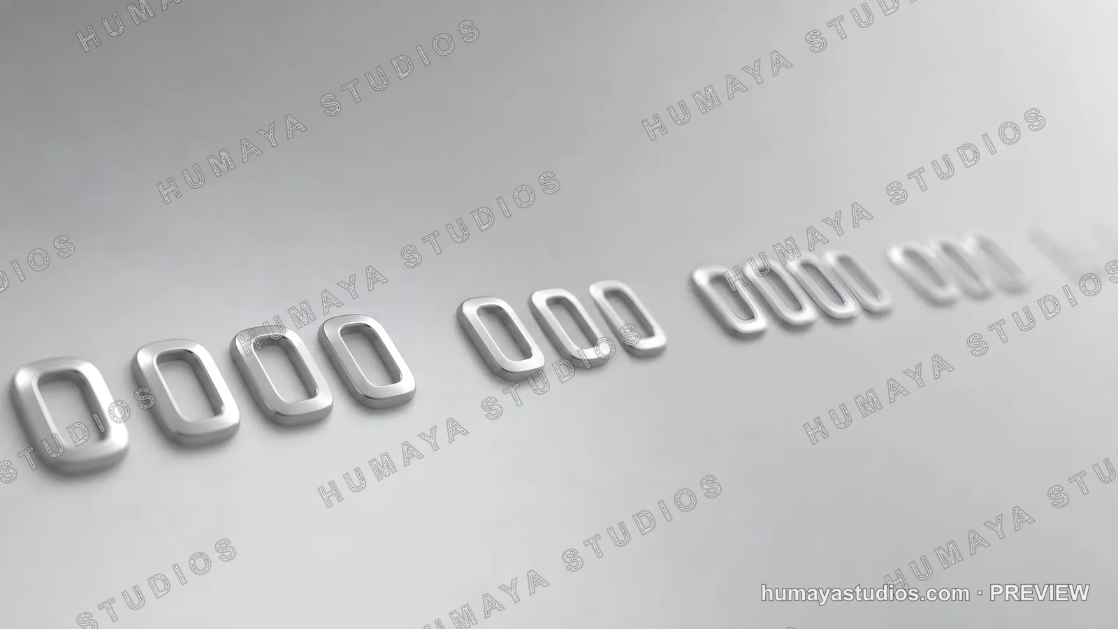 Close-up of embossed credit card numbers on a metallic surface