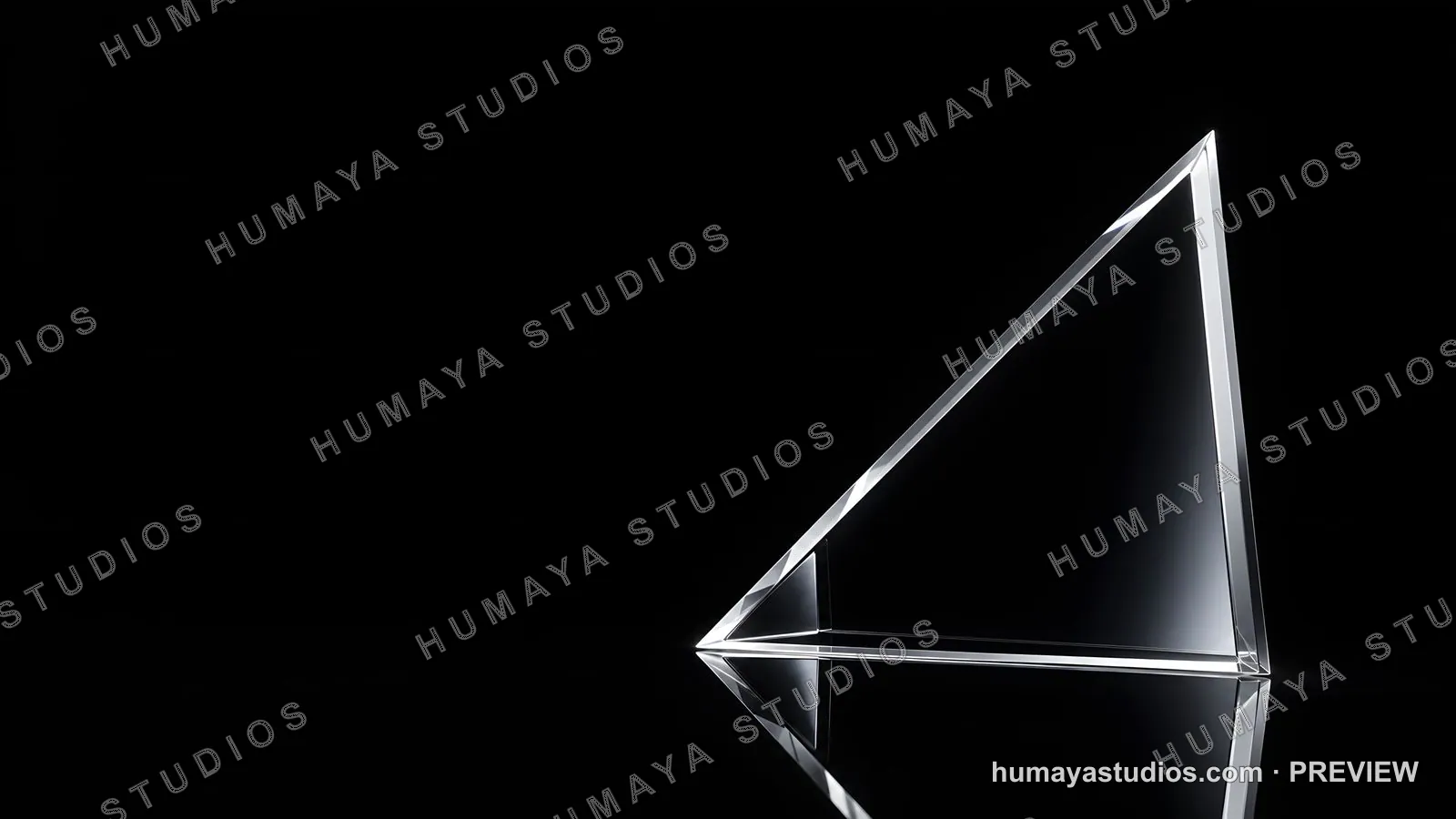Transparent glass prism on reflective dark surface