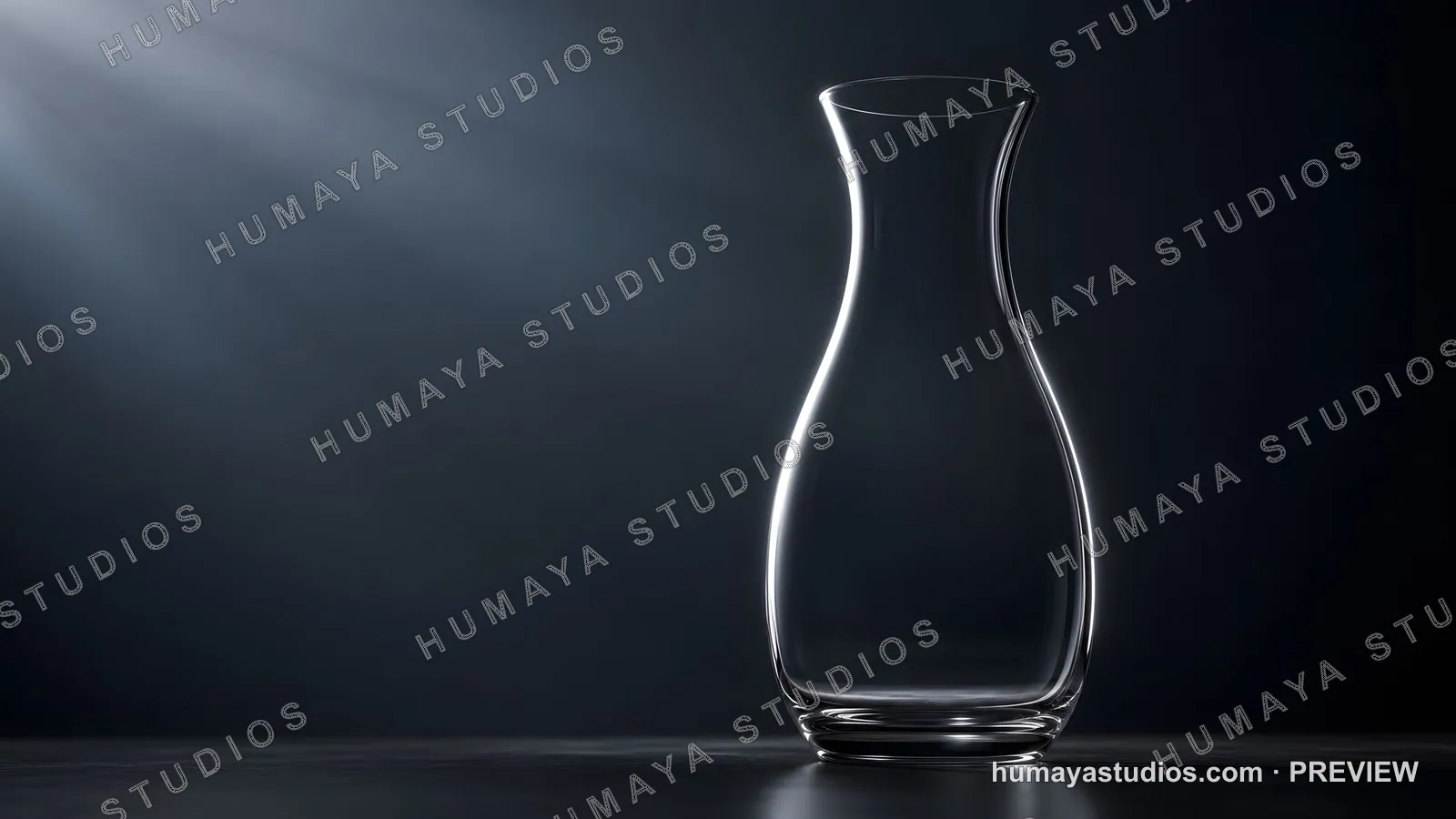 Empty glass decanter on dark table illuminated by directional light