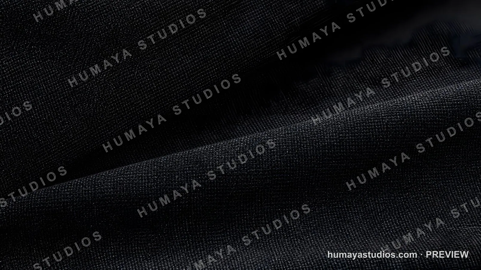 Black fabric texture with folds and shadows