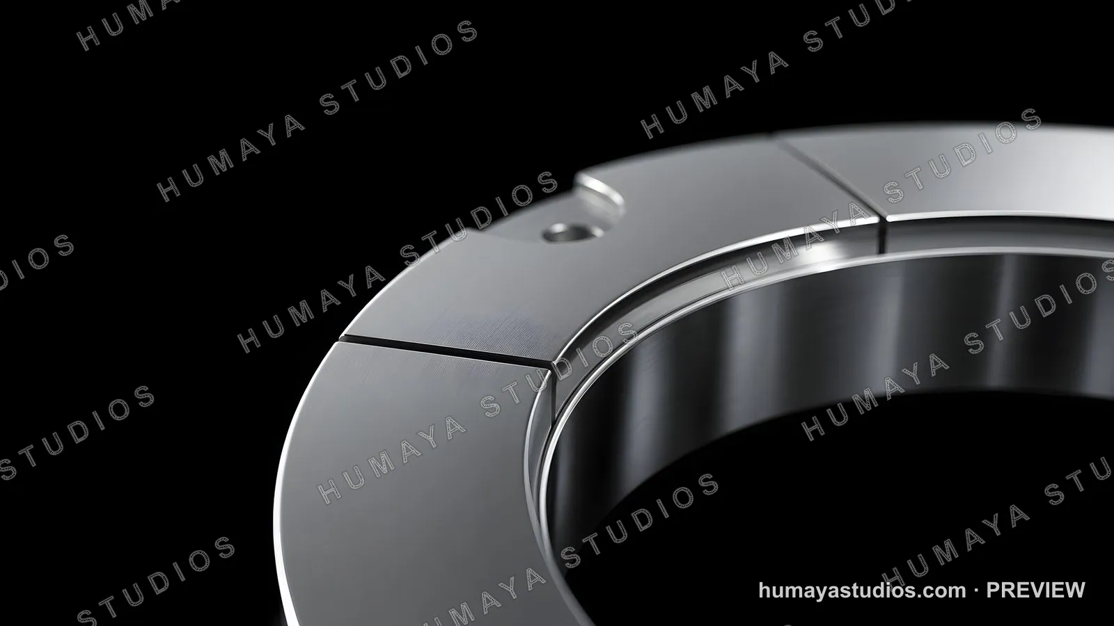 Close-up of metallic mechanical ring component on dark background