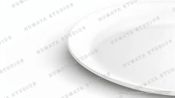 Close-up of a white ceramic plate on a white background