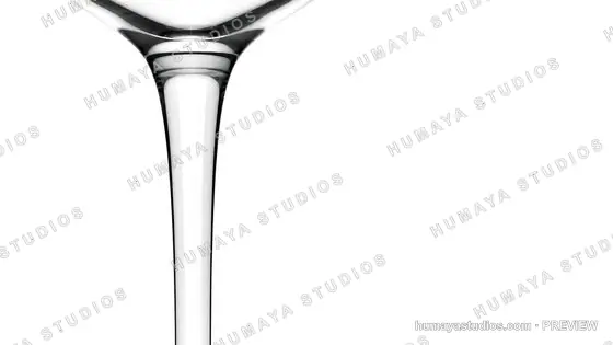 Close-up of a Crystal Wine Glass Stem and Bowl on White Background