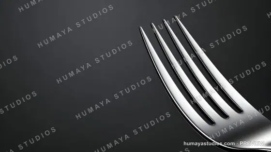 Shiny silver fork on dark background, kitchen utensil macro shot