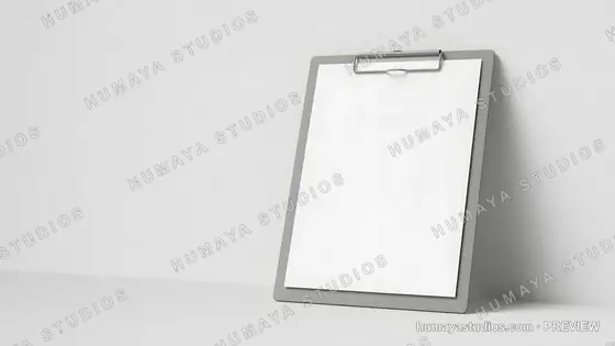 Vertical gray clipboard with blank white paper leaning against wall