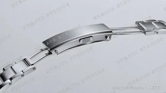 Close-up of a stainless steel watch clasp and bracelet link mechanism