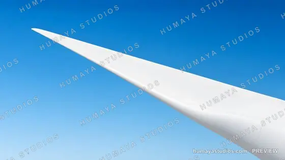 Wind Turbine Blade Tip Against Clear Blue Sky