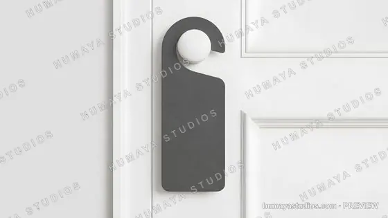 Blank gray door hanger mockup on a white panel door