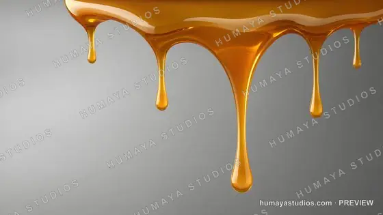 Golden Caramel Syrup Dripping on Gray Background