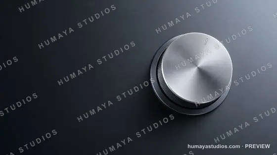 Metallic volume knob on dark background