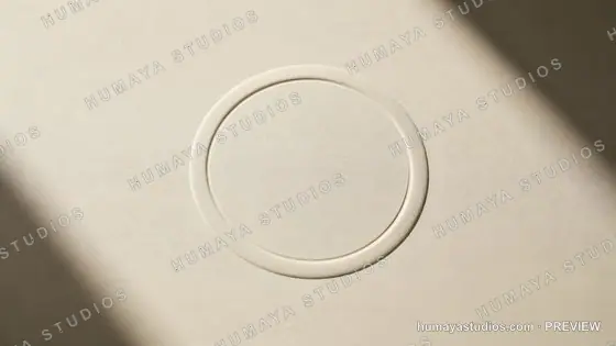 Minimalist beige paper texture with embossed round circle emblem