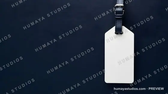Blank white luggage tag mockup on dark blue leather background