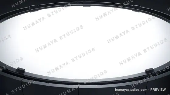 Circular light stage with metallic frame and glowing white display