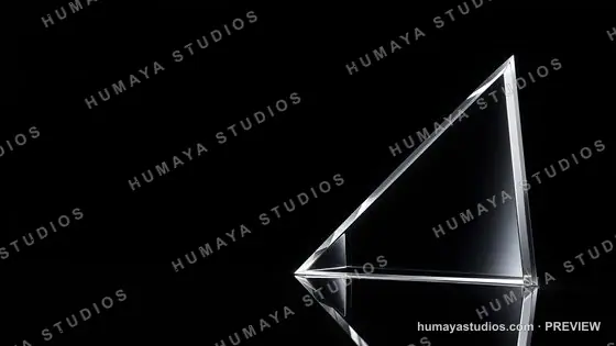 Transparent glass prism on reflective dark surface