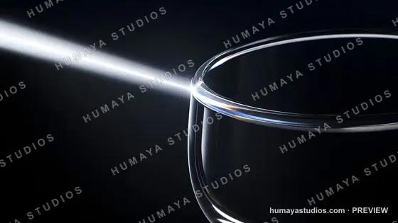Light Beam Striking a Glass Rim in Darkness