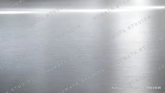 Brushed stainless steel background with metallic texture and light flare