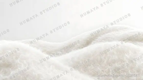 White fluffy wool fabric folds texture macro background