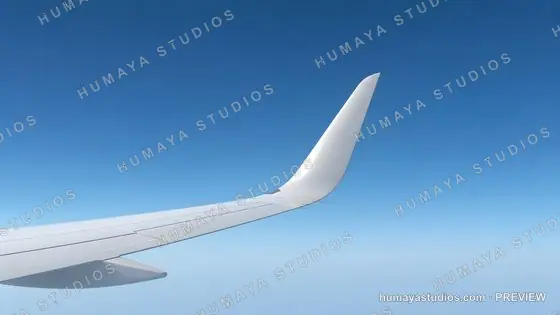 Airplane Winglet in Flight against Clear Blue Sky