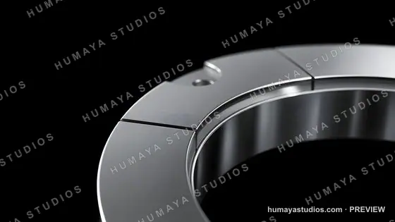 Close-up of metallic mechanical ring component on dark background
